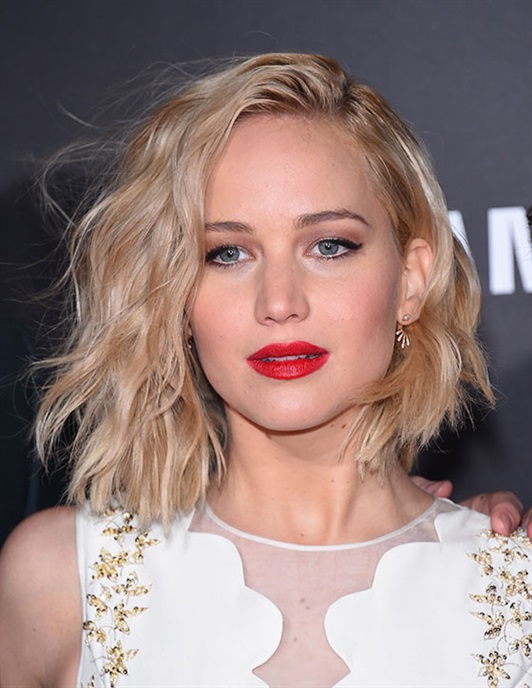 Hairstyles for Round Faces with Shaggy Bob Jennifer Lawrence is undoubtedly the person to look to for hairstyle inspiration for your round face. It is absolutely swinging its asymmetrical weight which draws the eyes downwards. Styled in bristly waves and a side parting, this bob works wonders at offsetting her round face structure.